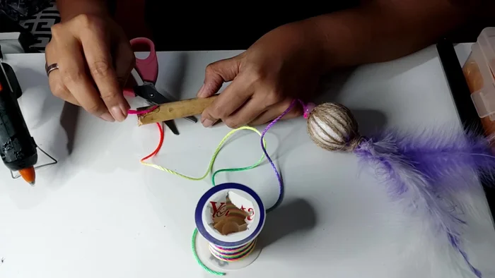 Glue the end of the paper rope to a dowel to create a wand handle.