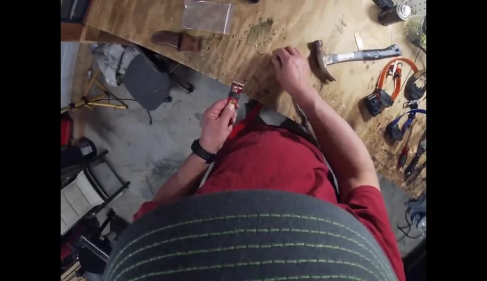 Repeat steps 2-4 for the second rivet on the name tag.