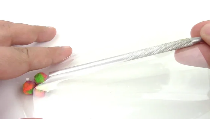 Make small, squishy catnip toys using self-seal bags and small balls. Seal the bags with packing tape.