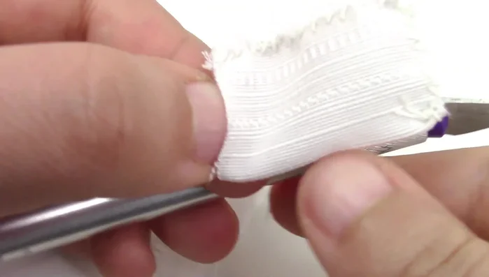 Create a small fabric pouch for extra catnip using fabric scraps and sewing or a glue gun.