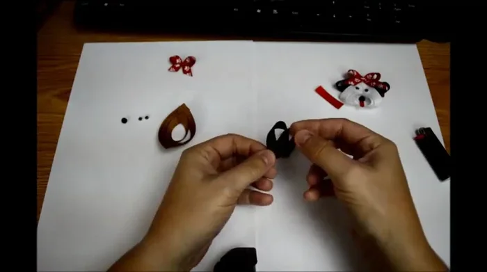 Make the ears: Create an awareness fold with two 3-inch pieces, shaping them like ears and gluing them down.