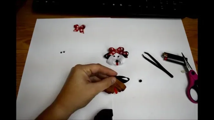 Add the nose and eyes: Glue a small black pom-pom to the center of the face as a nose. Attach google eyes.
