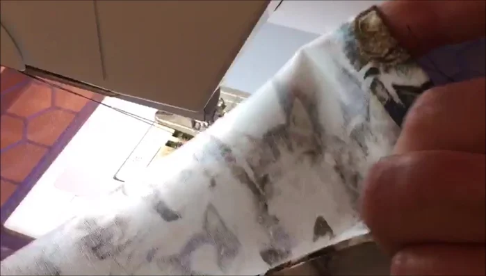 Line up one short end, pin it in place, and edge stitch close to the end, back tacking at the beginning. Sew this end closed.