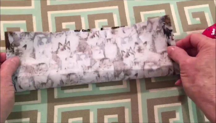 Fold the fabric lengthwise with pretty sides together and pin it in place.