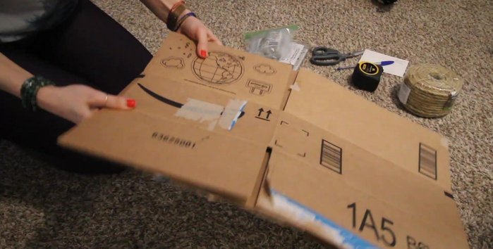 Find a suitable cardboard box. Cut and double up the cardboard to create a thicker, more durable base (approximately 13 inches by 22 inches).