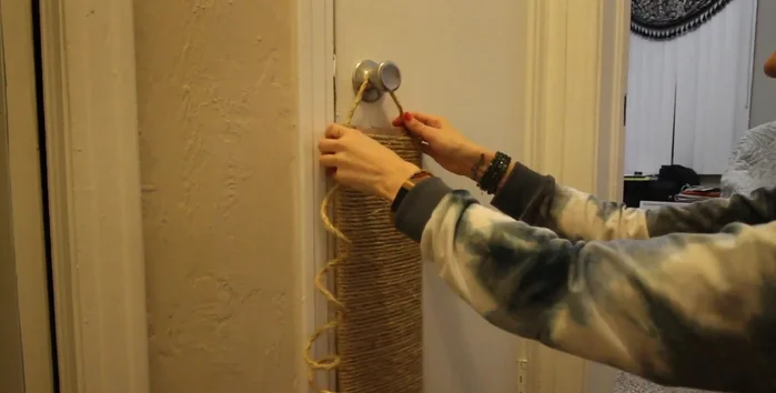 Adjust the length of the hanging ropes to your desired height. Add any optional embellishments (like a toy or catnip spray).