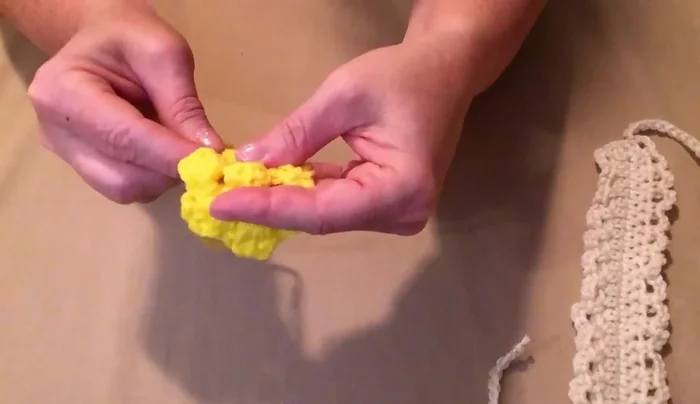 Sew the flower(s) onto the collar: Gather the center of the flower, sew to the collar center, and gently gather the petals to create a 3D effect.