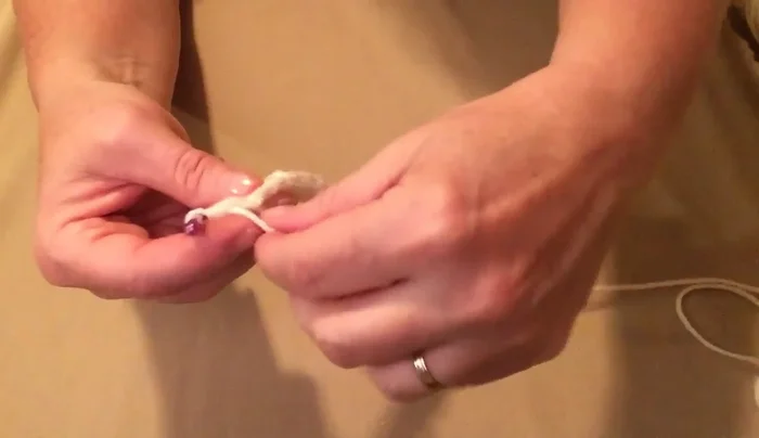 Turn and stitch down the opposite side of the chain with half double crochets, two in the first and last chains, one in the others.