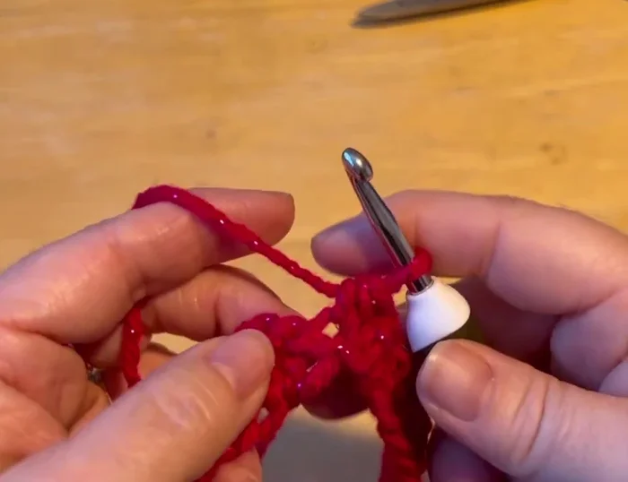 Continue with half double crochets in a spiral, working 12 rows on both sides of the hook for the body of the sweater.