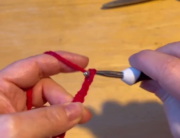 Continue with half double crochets in a spiral, working 12 rows on both sides of the hook for the body of the sweater.