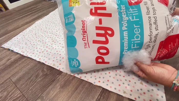 Sew the vertical lines on the pillow section, pressing flat to prevent bunching.