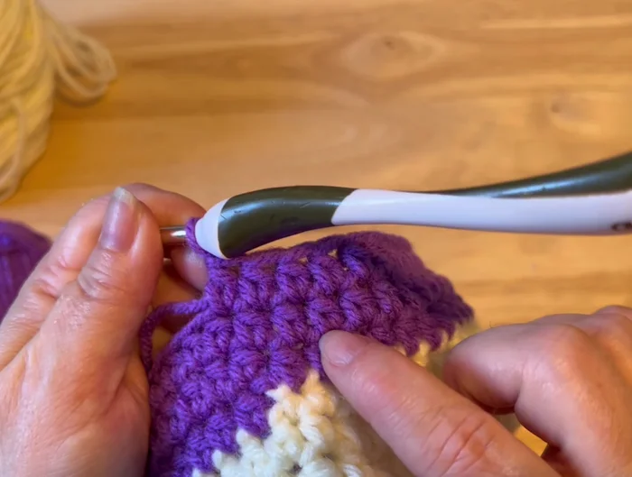 Slip stitch, change back to the original color, chain 2.