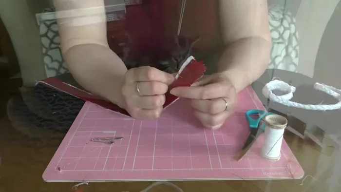 Sew across the pinned section to secure the strips (using a sewing machine or hand-stitching).