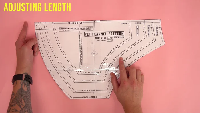 Adjust the neckline (if necessary) at the velcro edge of the chest panel. Add or subtract as needed.
