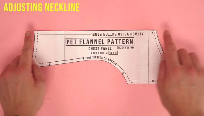 Adjust the neckline (if necessary) at the velcro edge of the chest panel. Add or subtract as needed.