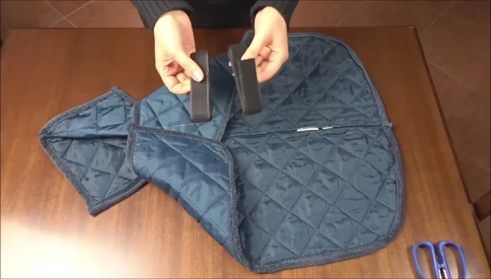 Sew a simple Velcro closure to the front of the jacket and use a duck stitch.