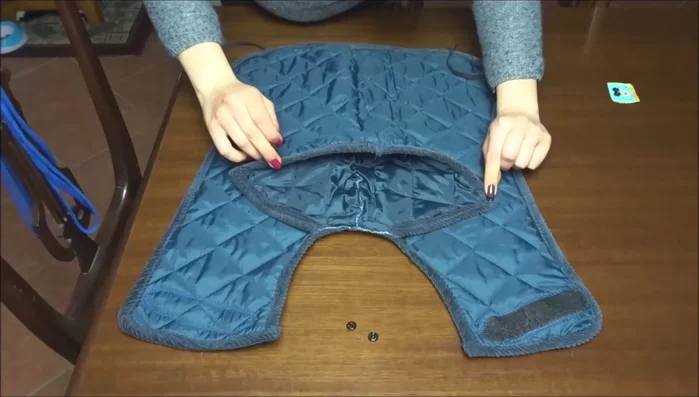 Attach button fasteners to the hood and collar for adjustable hood positions.