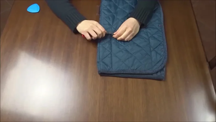 Sew the pockets onto the jacket.