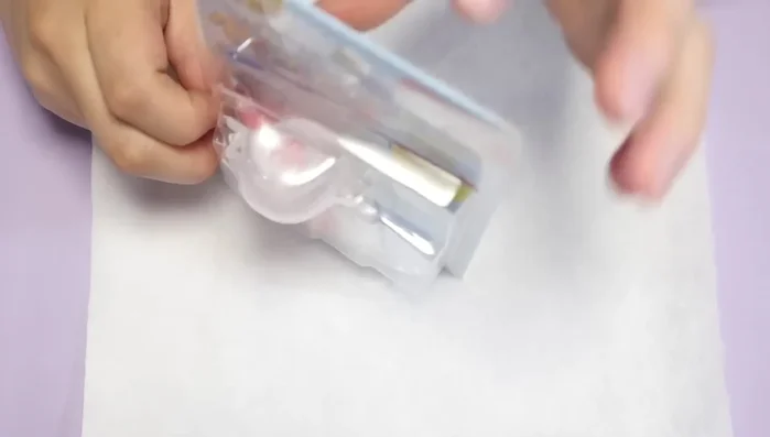 Mix your desired colors of sand and acrylic.