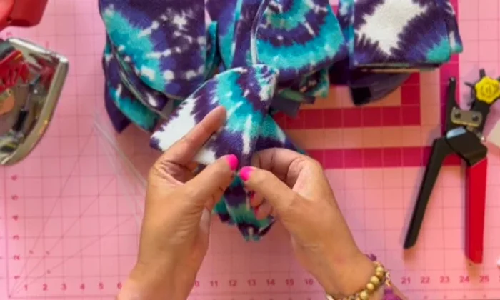 Punch holes: Use a leather punching tool to create a hole near the top of each folded quarter.