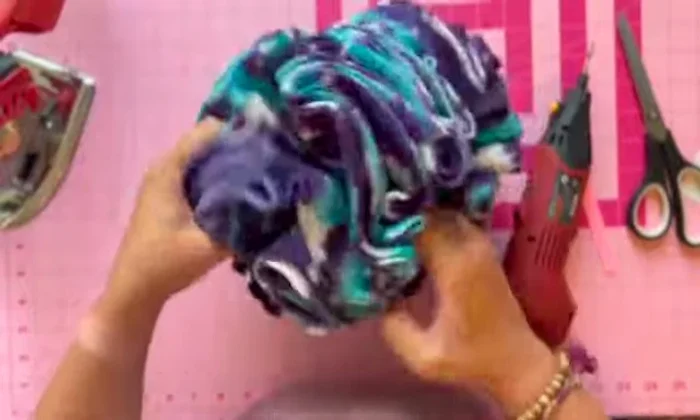 Final touches: Tighten the zip tie holding all the layers together to achieve the round snuffle ball shape.