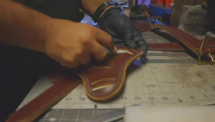 Attach the chest plate to the shoulder straps and belly strap.