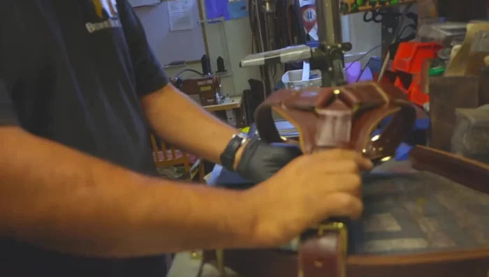 Attach the belly strap to the harness.