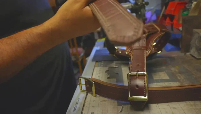 Punch holes in the belly strap for attachment.