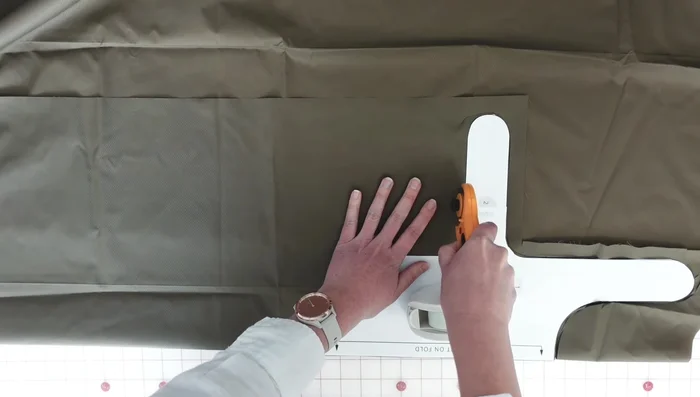 Cut the fabric: Cut the exterior layer from ripstop nylon on the fold, and the lining layer from sherpa fleece using the exterior layer as a pattern.