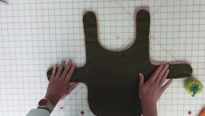 Assemble the coat: Sew the exterior and lining layers together, right sides facing, leaving a gap for turning.