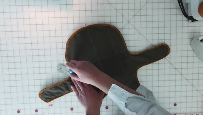 Quilt the layers: Mark quilting lines at a 45-degree angle and sew them using a contrast thread and microtex needle.