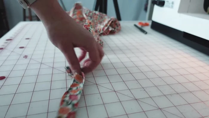 Add a buttonhole for the leash: Create a placket from interfaced fabric and sew it to the top center of the coat. Sew a buttonhole for your dog's leash D-ring.