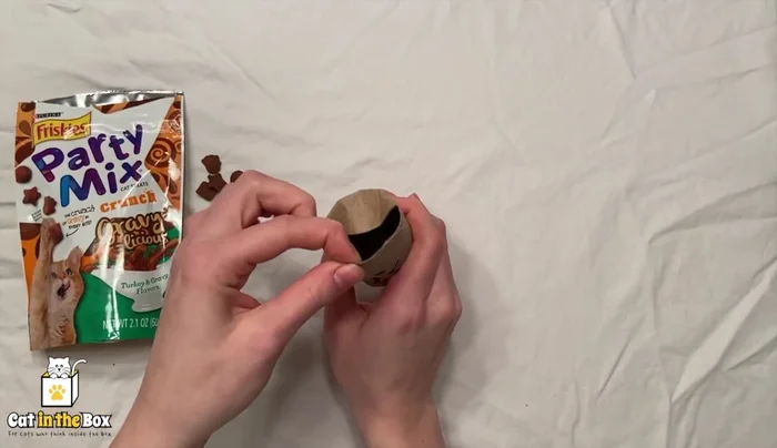 Open one end and add treats.