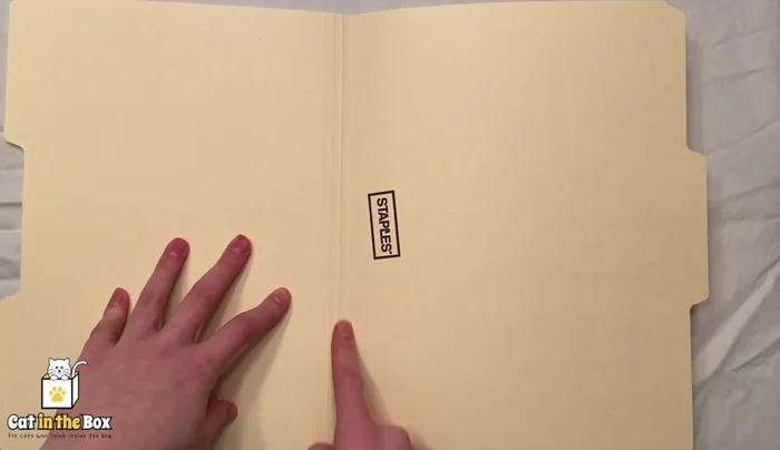 Cut the envelope/paper into smaller pieces.