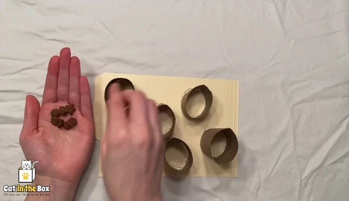 Place treats inside the glued-on tubes.