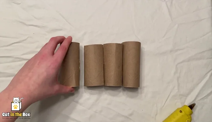 Repeat with two more tubes and then one more tube to complete the triangle.