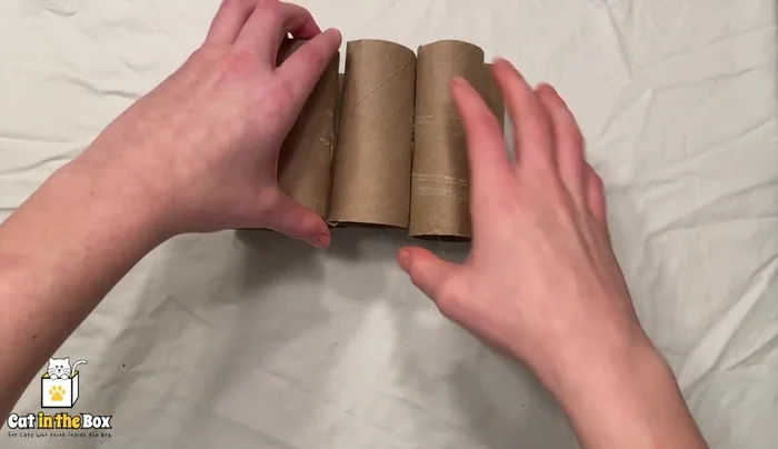 Repeat with two more tubes and then one more tube to complete the triangle.