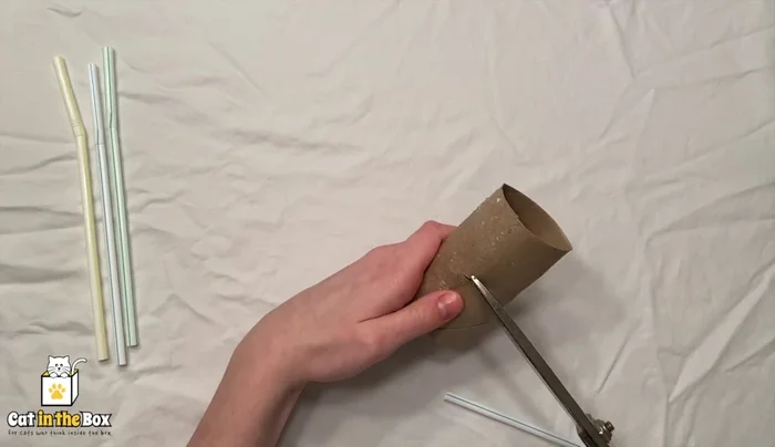 Make the holes slightly bigger if needed to accommodate the straws.