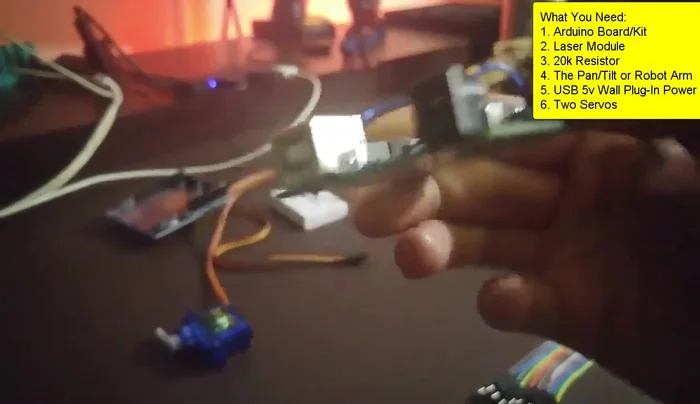 Gather all the components: Arduino Uno, servos (from a pan-tilt kit), wires, breadboard (optional), resistor, 5V power supply, and laser.