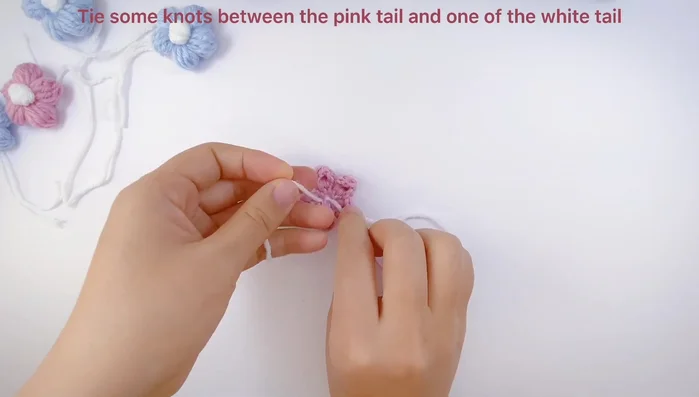 Attach the flowers: Secure the flowers to the collar using either glue or by tying the flowers onto the base.