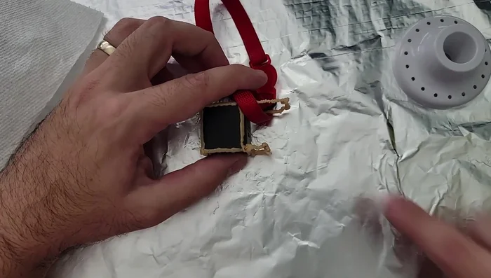 Finish the frame: Draw two final lines connecting the front and back supports. Let the plastic cool completely.