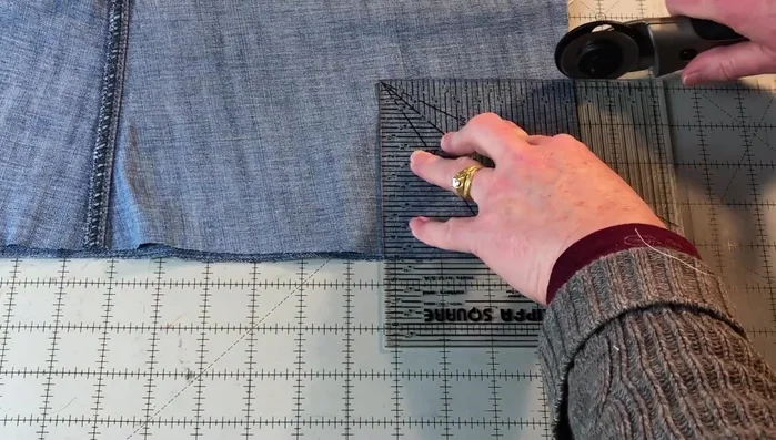 Create box corners: Cut 4 1/2 inch squares from each corner of both fabrics. Sew these squares to create box corners, resulting in 5in high sides.