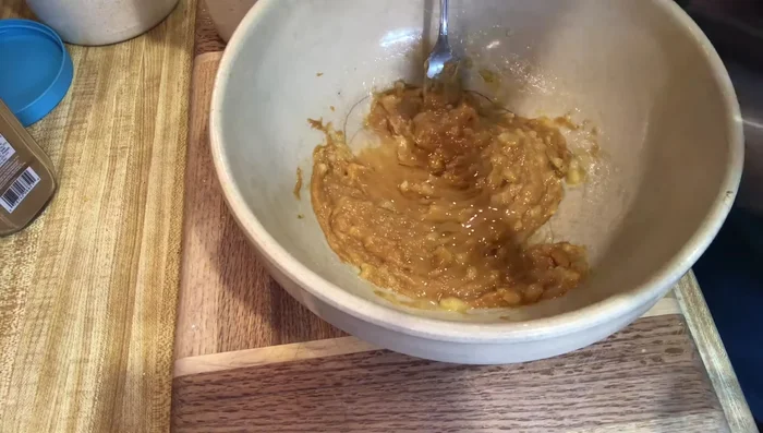 Gradually add 2 cups of ground organic oats and 1 teaspoon of cinnamon, mixing until a dough forms. Add more oats if needed to reach a workable consistency.