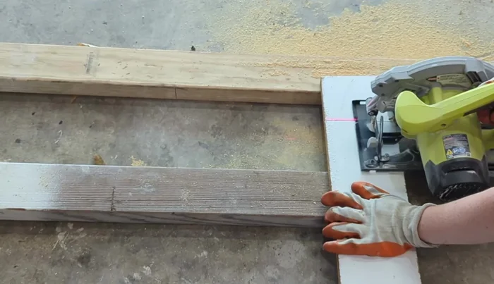 Create Cat House: Cut rounded openings for doors in the designated wood pieces. Sand all cut edges for smoothness.