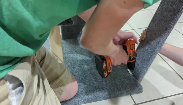 Attach Ramp: Using hinges, attach the ramp to the platform.