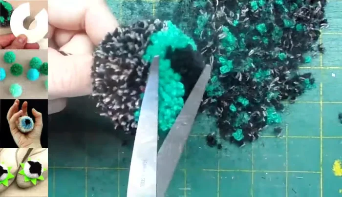 Trim the pom-pom to achieve a smooth, rounded shape, revealing the cat's eye design.