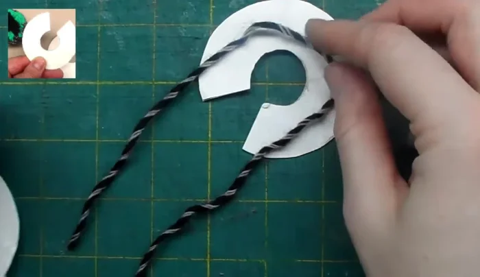 Tie off the black yarn securely.