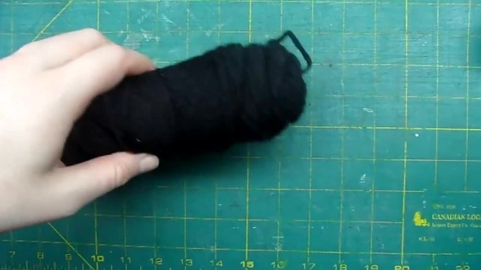 Prepare your cardboard pom-pom makers and yarn. Decide on your three colors (e.g., black, green, and a lighter color).