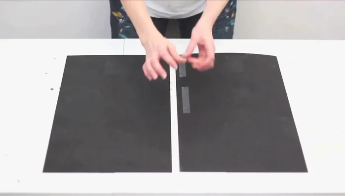 Create and attach the back panel. Affix two thin boards, place the frame on top, trace and cut the outline. Add the back panel using wood glue and nails.