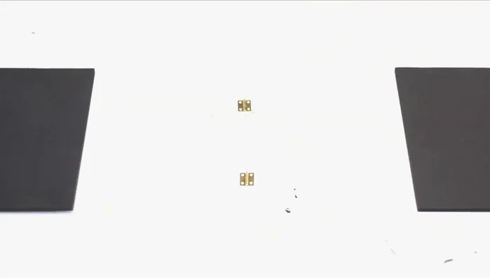 Assemble the A-frame roof. Place triangles on the outer edges of the first roof board, add the second roof board, and nail them together. Flip and repeat for secure fastening. A friend can help hold pieces.